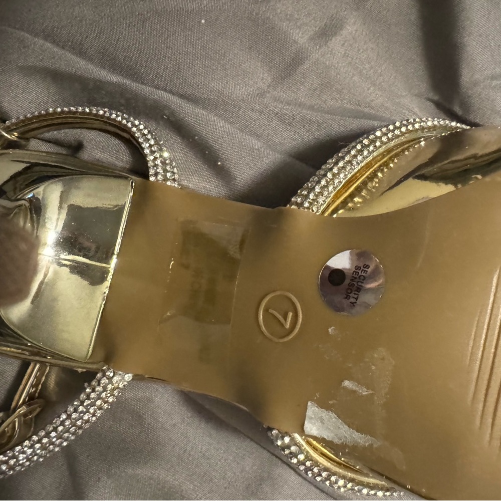 Gorgeous gold heels with rhinestone bow accent